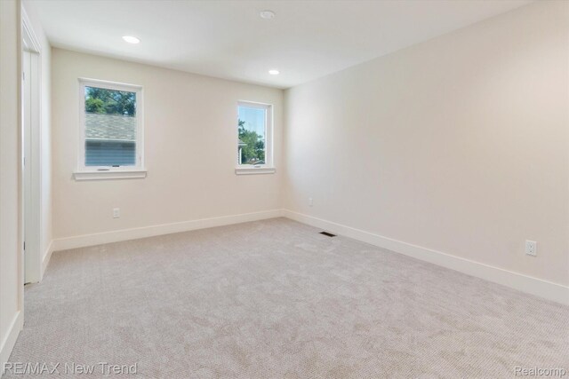 2911 Walsh Dr, Rochester Hills, MI 48309 - spare room with plenty of natural light, carpet, baseboards, and recessed lighting