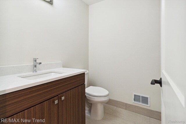 2911 Walsh Dr, Rochester Hills, MI 48309 - half bath with vanity, toilet, and tile patterned floors