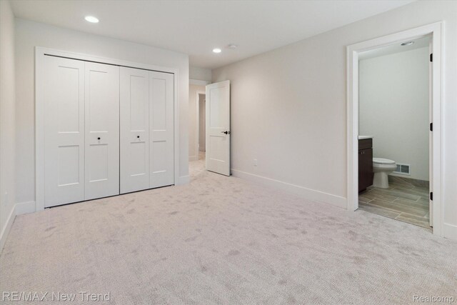 2911 Walsh Dr, Rochester Hills, MI 48309 - unfurnished bedroom featuring carpet, recessed lighting, a closet, baseboards, and ensuite bath