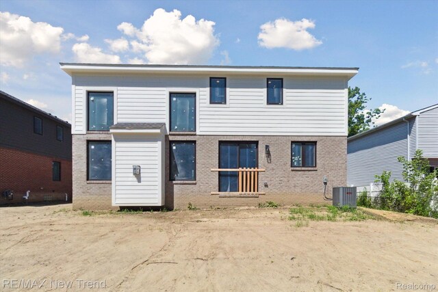 2911 Walsh Dr, Rochester Hills, MI 48309 - rear view of house with cooling unit and brick siding
