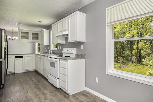 7929 N 48th St, Augusta, MI 49012 - kitchen with white range with electric cooktop, under cabinet range hood, stainless steel fridge, white cabinets, and a textured ceiling