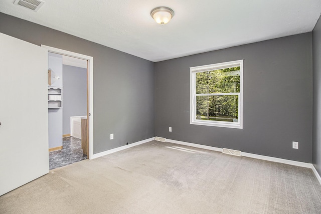 7929 N 48th St, Augusta, MI 49012 - unfurnished bedroom with carpet floors and baseboards