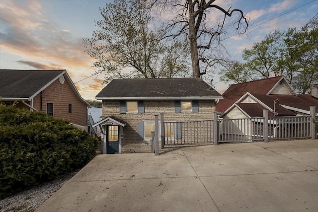 68398 Dailey Rd, Edwardsburg, MI 49112 - back of house at dusk with stone siding