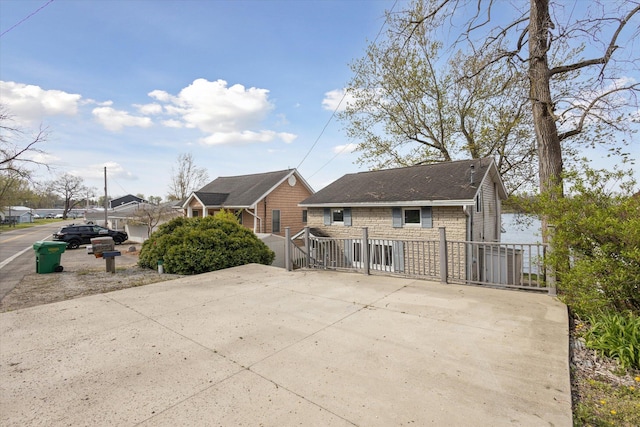 68398 Dailey Rd, Edwardsburg, MI 49112 - back of property with stone siding and a shingled roof