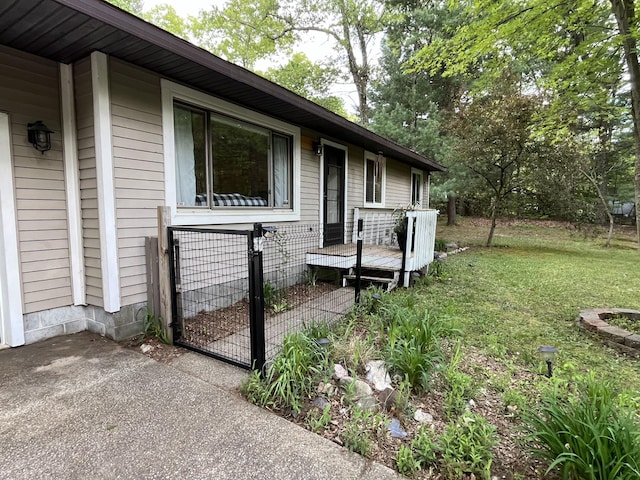 6530 Blue Lake Rd, Twin Lake, MI 49457 - view of home's exterior with a lawn and a wooden deck