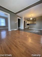 41 Maple St, River Rouge, MI 48218 - unfurnished living room featuring wood finished floors and baseboards