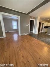 41 Maple St, River Rouge, MI 48218 - unfurnished living room with wood finished floors and baseboards