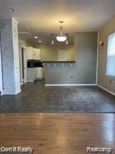 41 Maple St, River Rouge, MI 48218 - unfurnished living room featuring dark wood-type flooring, baseboards, and recessed lighting