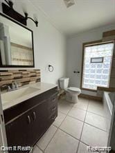 41 Maple St, River Rouge, MI 48218 - bathroom featuring vanity, toilet, tile patterned flooring, and a bath