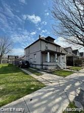 41 Maple St, River Rouge, MI 48218 - view of home's exterior featuring a lawn