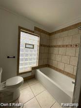41 Maple St, River Rouge, MI 48218 - full bathroom featuring toilet, a tub to relax in, and tile patterned floors