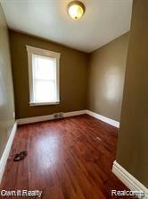 41 Maple St, River Rouge, MI 48218 - spare room with wood finished floors and baseboards