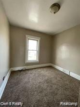 41 Maple St, River Rouge, MI 48218 - unfurnished room featuring dark colored carpet and baseboards