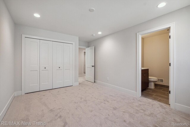 2921 Walsh Dr, Rochester Hills, MI 48309 - unfurnished bedroom featuring carpet, recessed lighting, baseboards, a closet, and ensuite bath
