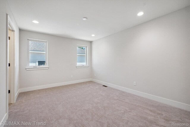 2921 Walsh Dr, Rochester Hills, MI 48309 - unfurnished room featuring baseboards, light carpet, and recessed lighting