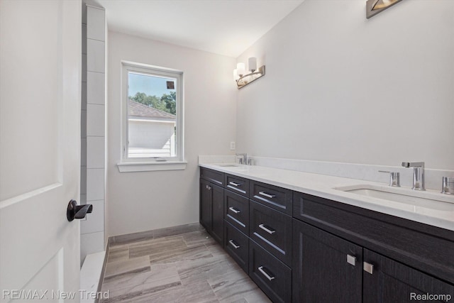 2921 Walsh Dr, Rochester Hills, MI 48309 - bathroom with double vanity and baseboards