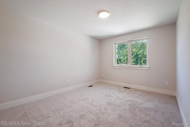 2921 Walsh Dr, Rochester Hills, MI 48309 - carpeted empty room with baseboards