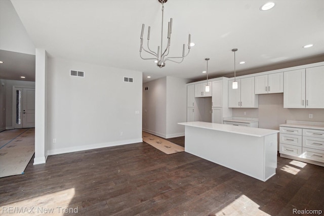 2921 Walsh Dr, Rochester Hills, MI 48309 - kitchen featuring white cabinetry, recessed lighting, a center island, dark wood finished floors, and light countertops