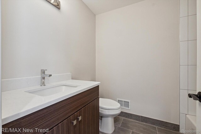 2921 Walsh Dr, Rochester Hills, MI 48309 - full bathroom with toilet, vanity, baseboards, tile patterned floors, and tub / shower combination