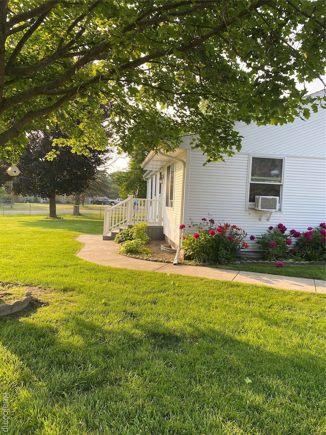 7053 Allegan Dr, Davison, MI 48423 - view of side of home with a yard and cooling unit