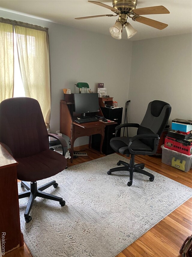 7053 Allegan Dr, Davison, MI 48423 - home office with wood finished floors and ceiling fan