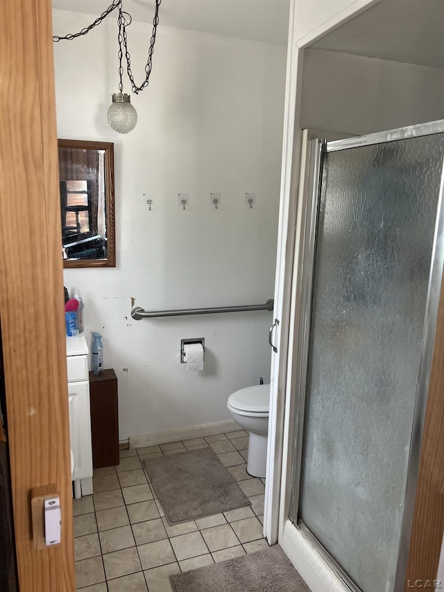 760 W Michigan Ave, Adrian, MI 49221 - bathroom featuring a shower stall, tile patterned floors, toilet, and vanity