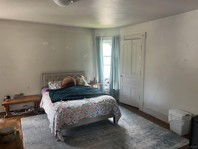 760 W Michigan Ave, Adrian, MI 49221 - bedroom with wood finished floors and baseboards
