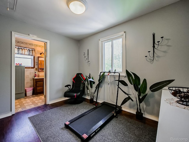 1468 Ruby Ave, Rochester Hills, MI 48309 - exercise area with dark wood finished floors and baseboards