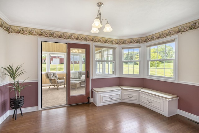 6541 S 6th St, Kalamazoo, MI 49008 - unfurnished dining area featuring a chandelier, plenty of natural light, dark wood-style floors, crown molding, and baseboards