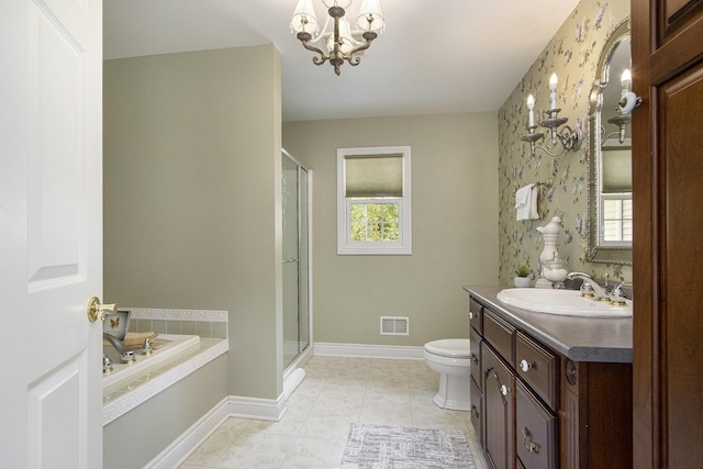 6541 S 6th St, Kalamazoo, MI 49008 - bathroom with vanity, a stall shower, a bath, toilet, and baseboards