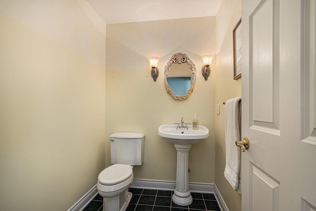 6541 S 6th St, Kalamazoo, MI 49008 - bathroom with tile patterned floors, toilet, and baseboards