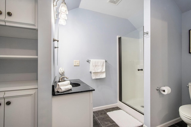 6541 S 6th St, Kalamazoo, MI 49008 - bathroom featuring toilet, a stall shower, vanity, lofted ceiling, and baseboards