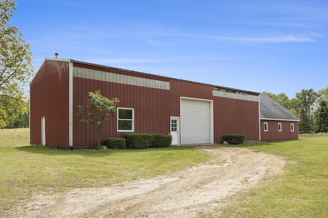 6541 S 6th St, Kalamazoo, MI 49008 - view of pole building with driveway and a yard