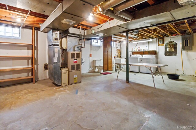 13128 Talbot Ave, Huntington Woods, MI 48070 - below grade area featuring separate washer and dryer, electric panel, and heating unit