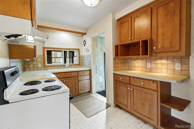 13128 Talbot Ave, Huntington Woods, MI 48070 - kitchen featuring white electric range oven, under cabinet range hood, open shelves, light flooring, and light countertops