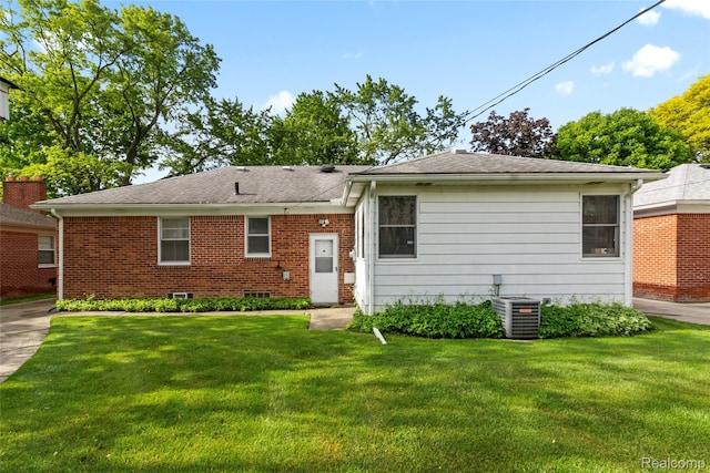 13128 Talbot Ave, Huntington Woods, MI 48070 - back of house featuring central air condition unit, a lawn, brick siding, and a shingled roof