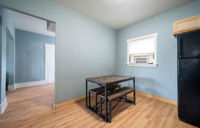 13 Rena St SW, Grand Rapids, MI 49507 - dining space featuring light wood-style flooring, cooling unit, and baseboards