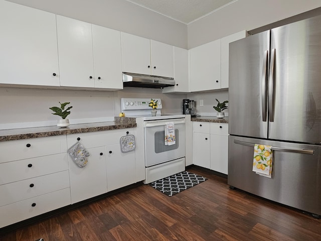 1114 E Michigan Ave, Albion, MI 49224 - kitchen with freestanding refrigerator, white electric range oven, under cabinet range hood, and white cabinets