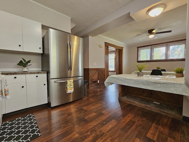 1114 E Michigan Ave, Albion, MI 49224 - kitchen featuring freestanding refrigerator, dark wood-style floors, wainscoting, white cabinetry, and a ceiling fan