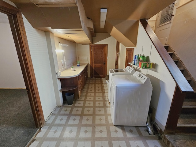 1114 E Michigan Ave, Albion, MI 49224 - washroom with light flooring, washing machine and clothes dryer, and baseboards