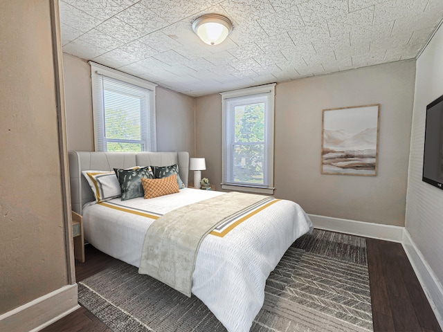 1114 E Michigan Ave, Albion, MI 49224 - bedroom with wood finished floors and baseboards