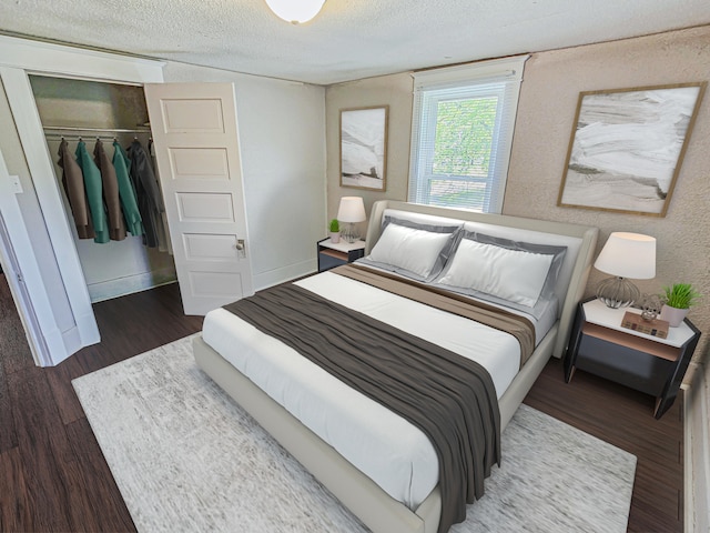 1114 E Michigan Ave, Albion, MI 49224 - bedroom featuring wood finished floors, a textured ceiling, a closet, and baseboards