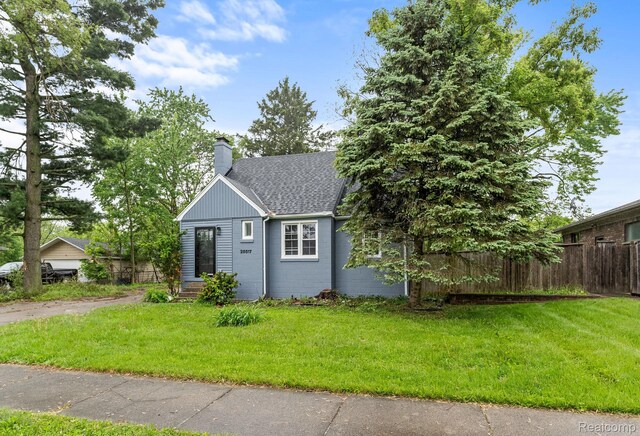28517 Aberdeen St, Southfield, MI 48076 - view of front of home featuring a chimney and roof with shingles