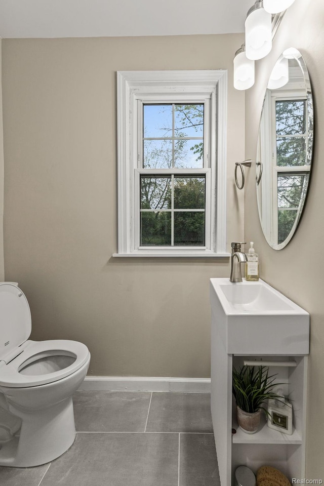 28517 Aberdeen St, Southfield, MI 48076 - half bath with baseboards, toilet, and tile patterned floors