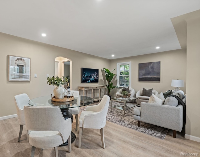 28517 Aberdeen St, Southfield, MI 48076 - dining space featuring light wood-style floors, arched walkways, baseboards, and recessed lighting