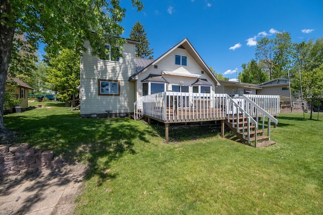 7945 W Royal Rd, Canadian Lakes, MI 49346 - back of house with a deck and a yard