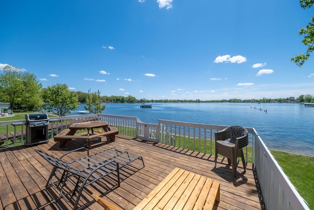 7945 W Royal Rd, Canadian Lakes, MI 49346 - wooden deck with area for grilling and a water view