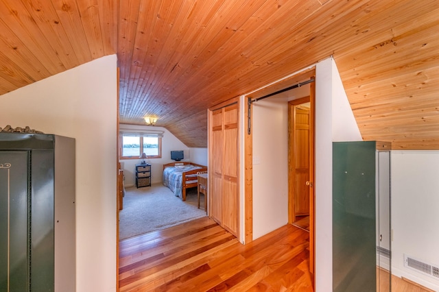 7945 W Royal Rd, Canadian Lakes, MI 49346 - bedroom featuring vaulted ceiling, wood ceiling, and light wood-style flooring