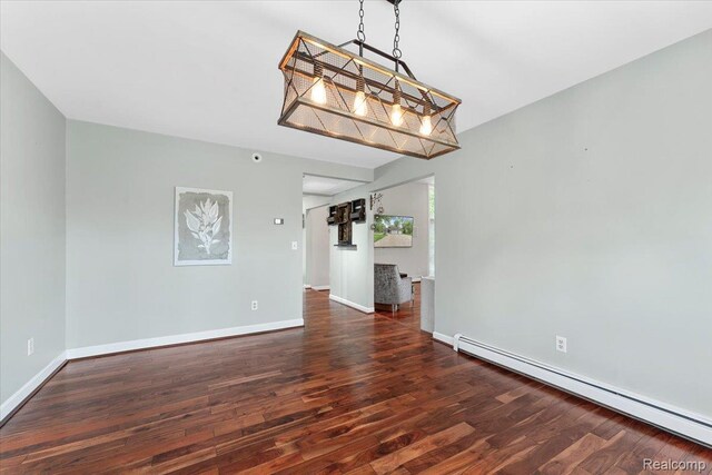10161 N Loma Cir, Grosse Ile, MI 48138 - unfurnished living room with baseboard heating, wood finished floors, and baseboards