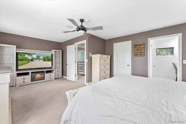 10161 N Loma Cir, Grosse Ile, MI 48138 - bedroom featuring light colored carpet, baseboards, and ceiling fan